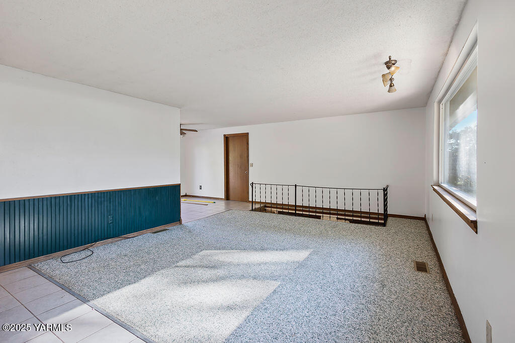 212 Anchor Loop Selah, WA 98942 - Photo 3 of 26 a view of a room with stairs and a window