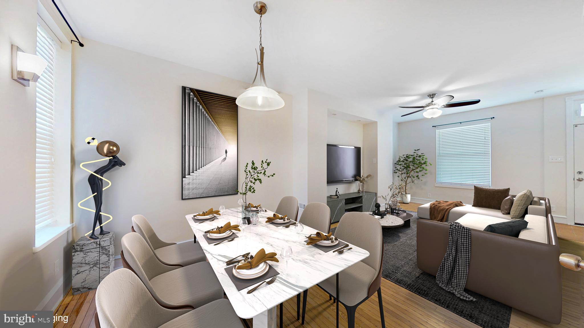 5142 Ranstead Street Philadelphia, PA 19139 - Photo 2 of 16 a living room with furniture and a chandelier