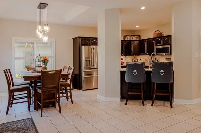 a dining room with furniture and window