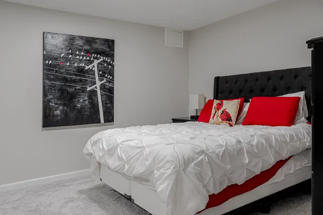 an aerial view of a house with swimming pool and garden