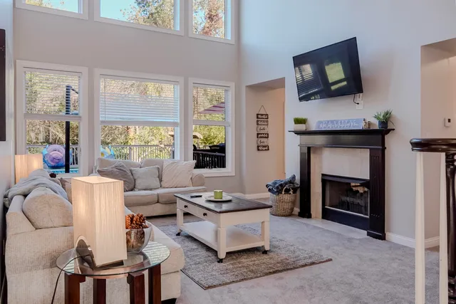 a view of hall way with furniture and a fireplace