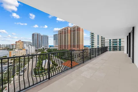 a living room with furniture flat screen tv and a fireplace
