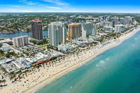a view of a livingroom with furniture and a book shelf