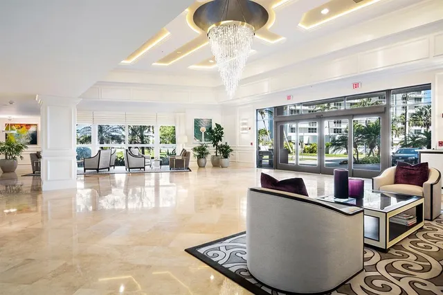 a view of swimming pool with outdoor seating and city view