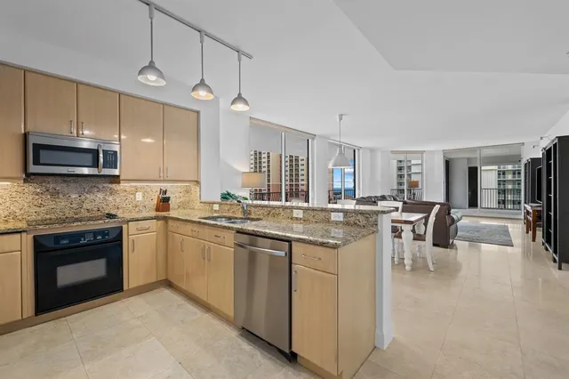 a kitchen with lots of counter top space and appliances