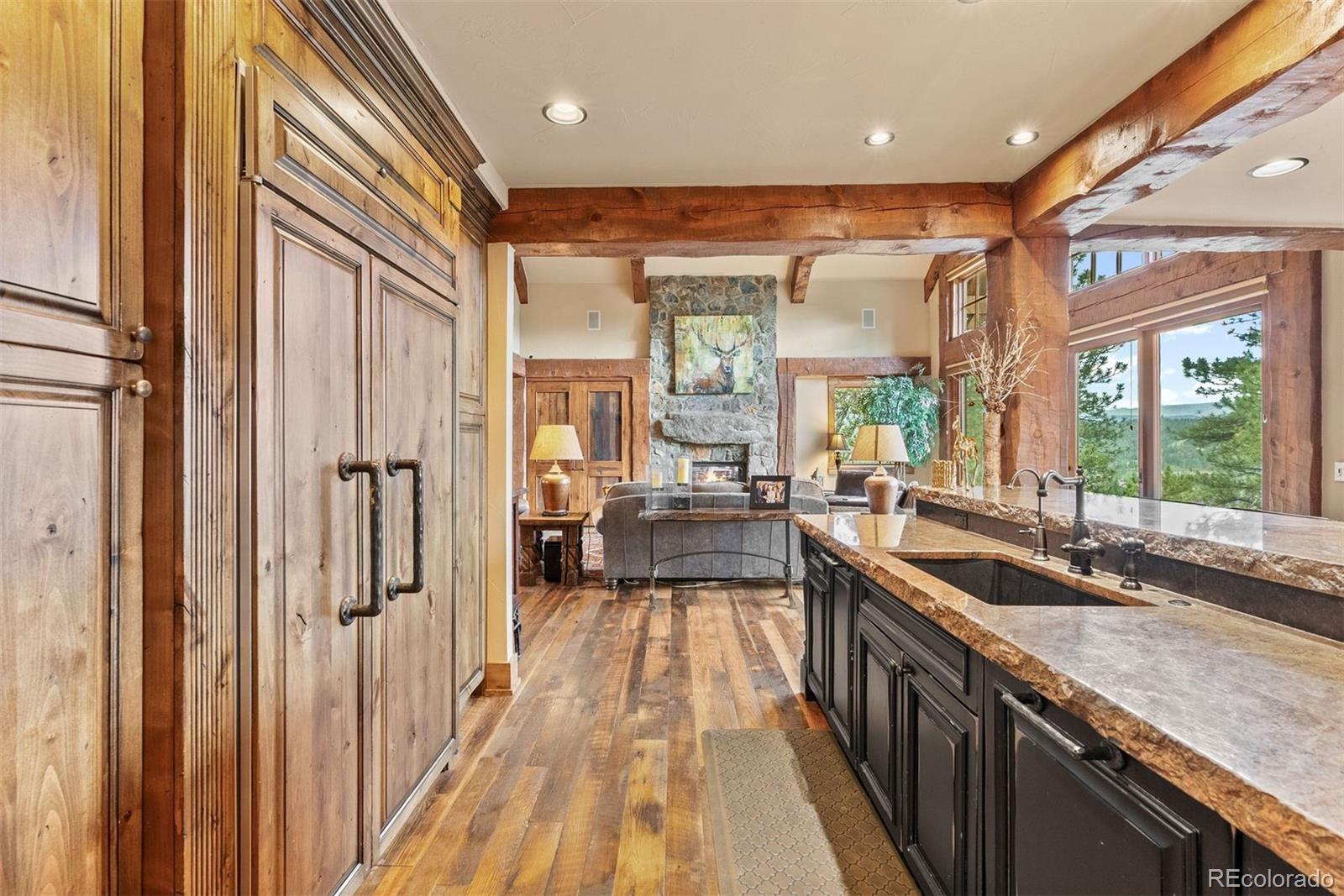 2929 Highlands View Road Evergreen, CO 80439 - Photo 11 of 50 a view of a kitchen with a large window