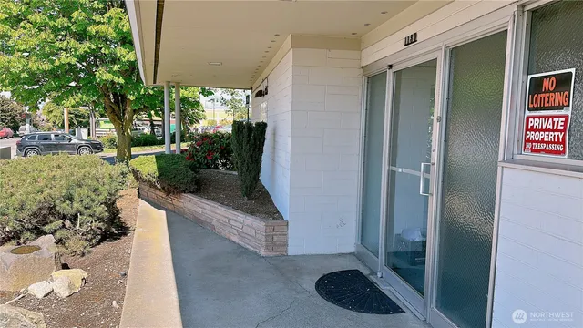 a view of a kitchen with furniture and a window