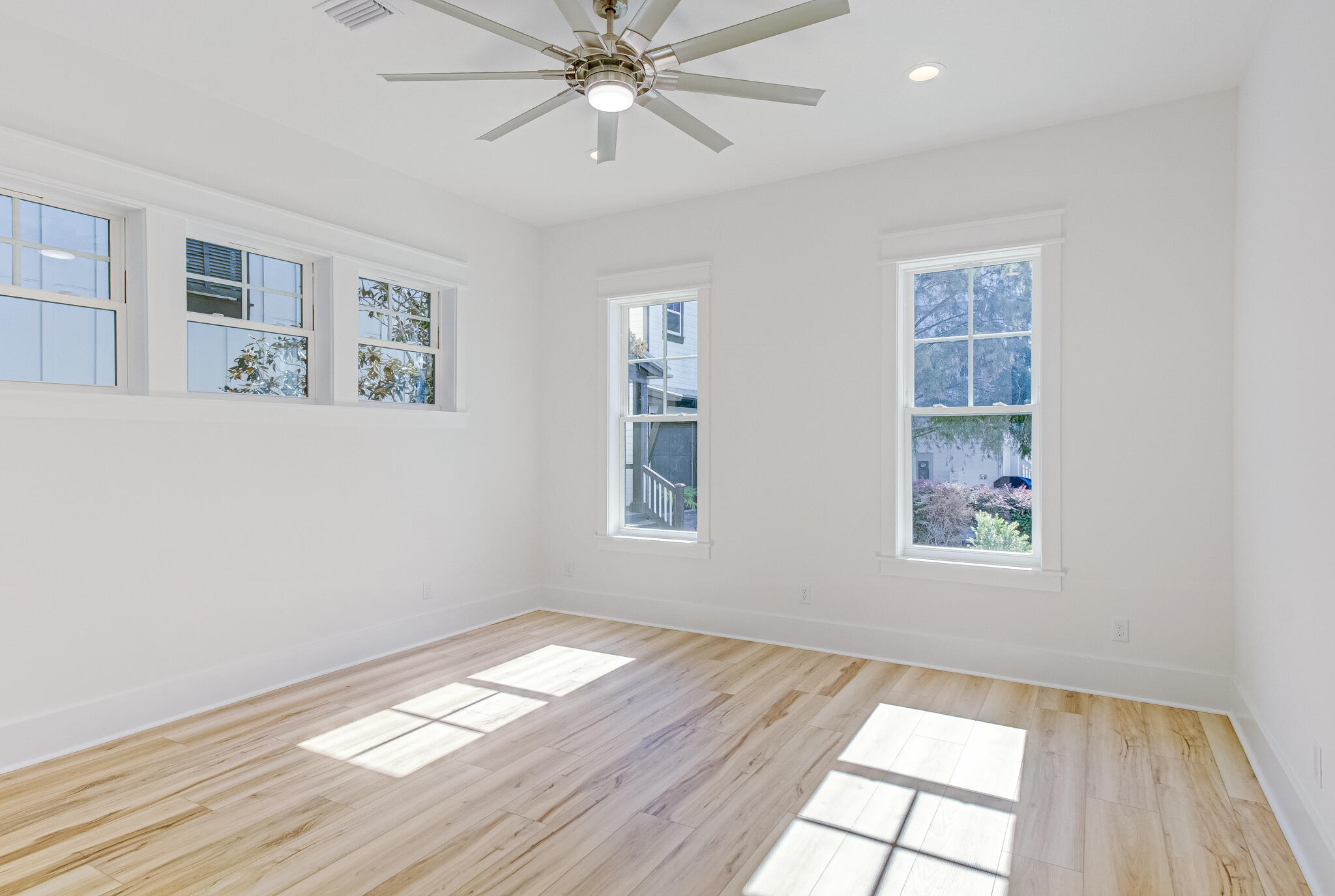 174 Grande Pointe Cir Inlet Beach Inlet Beach, FL 32461 - Photo 19 of 55 a view of an empty room with wooden floor and a window