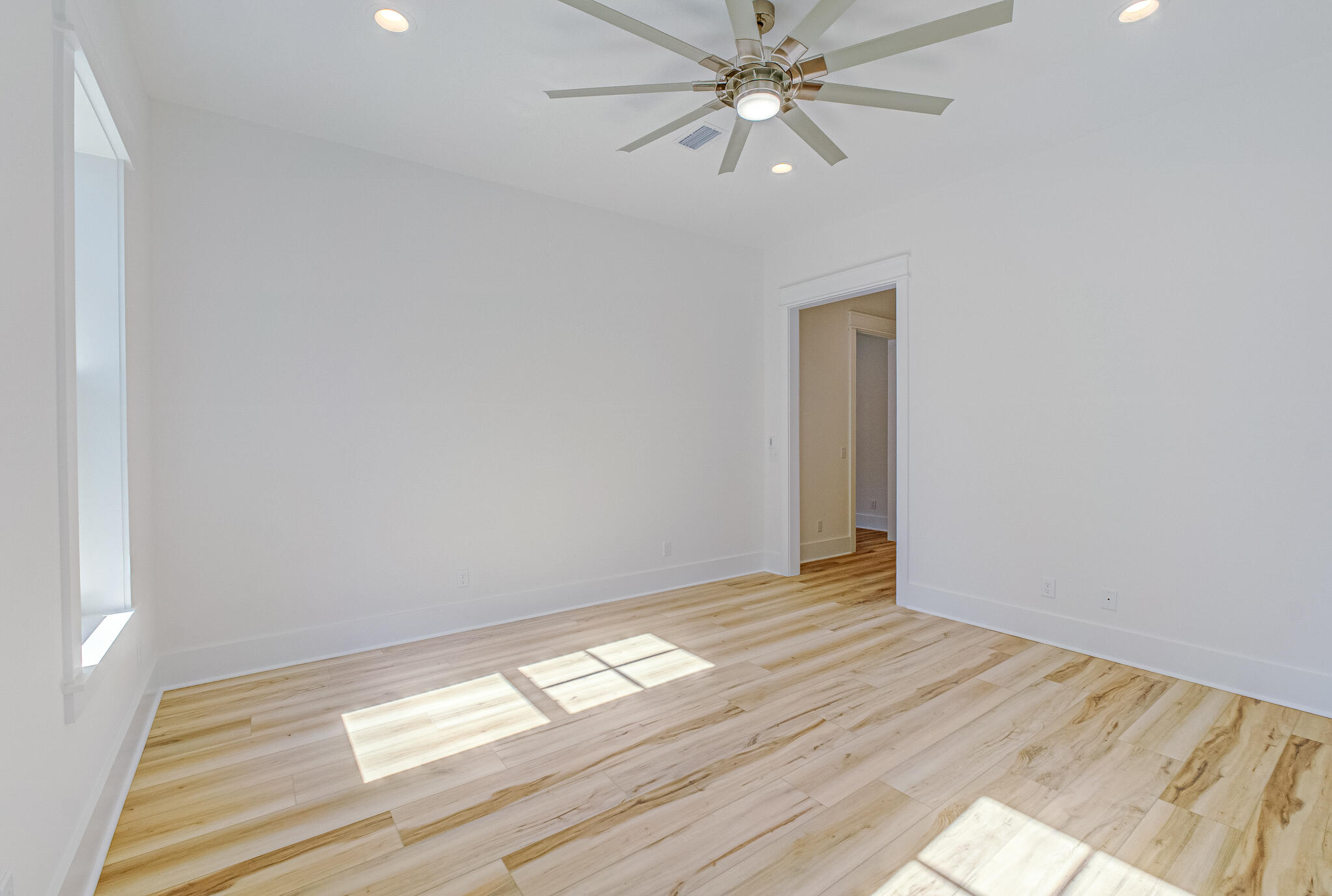 174 Grande Pointe Cir Inlet Beach Inlet Beach, FL 32461 - Photo 20 of 55 a view of empty room with wooden floor and fan