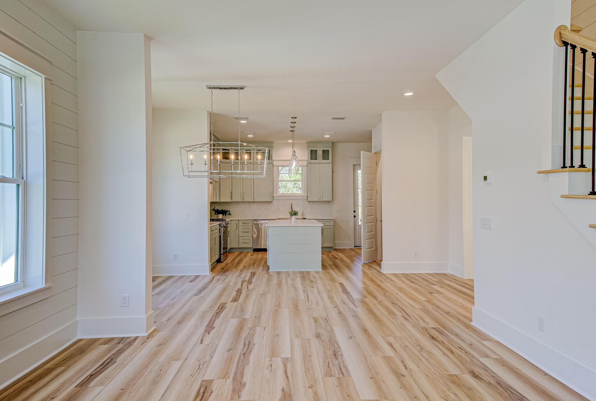 174 Grande Pointe Cir Inlet Beach Inlet Beach, FL 32461 - Photo 21 of 55 a view of a kitchen with wooden floor and a large window