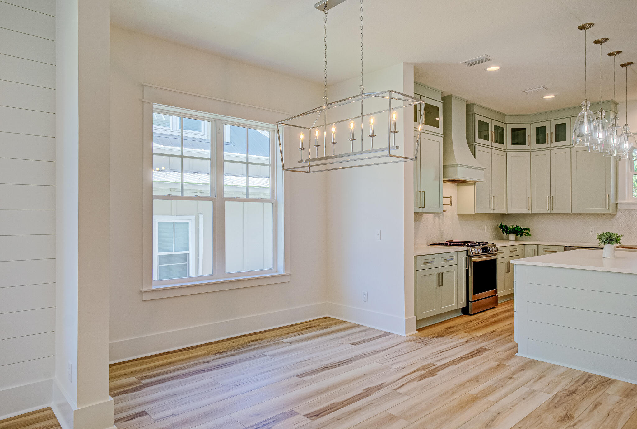 174 Grande Pointe Cir Inlet Beach Inlet Beach, FL 32461 - Photo 22 of 55 a kitchen with stainless steel appliances granite countertop a refrigerator and a stove top oven