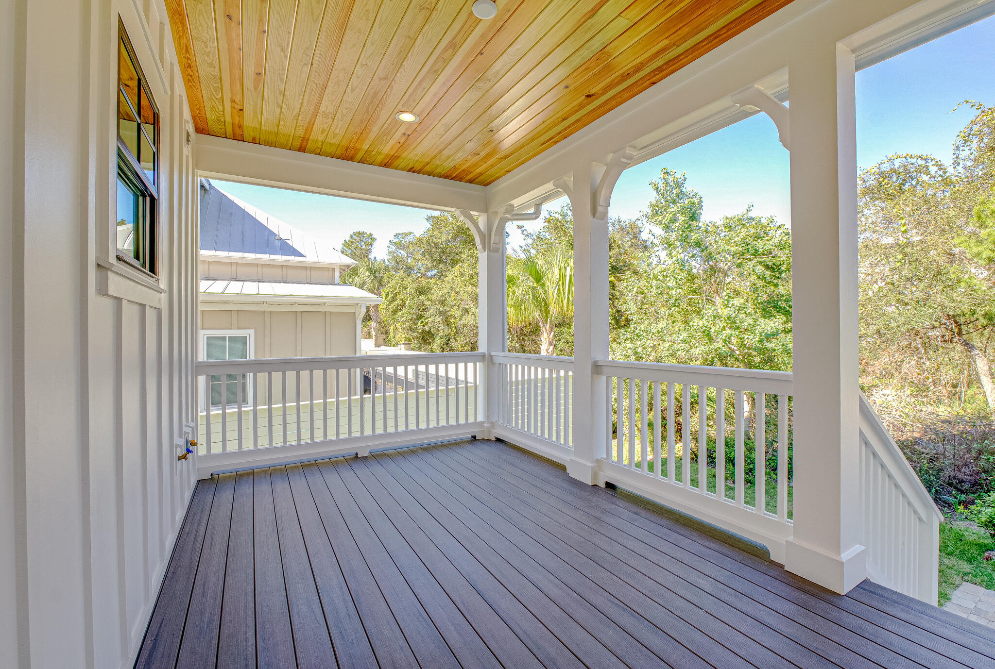 174 Grande Pointe Cir Inlet Beach Inlet Beach, FL 32461 - Photo 27 of 55 a view of a porch with wooden floor and floor to ceiling window