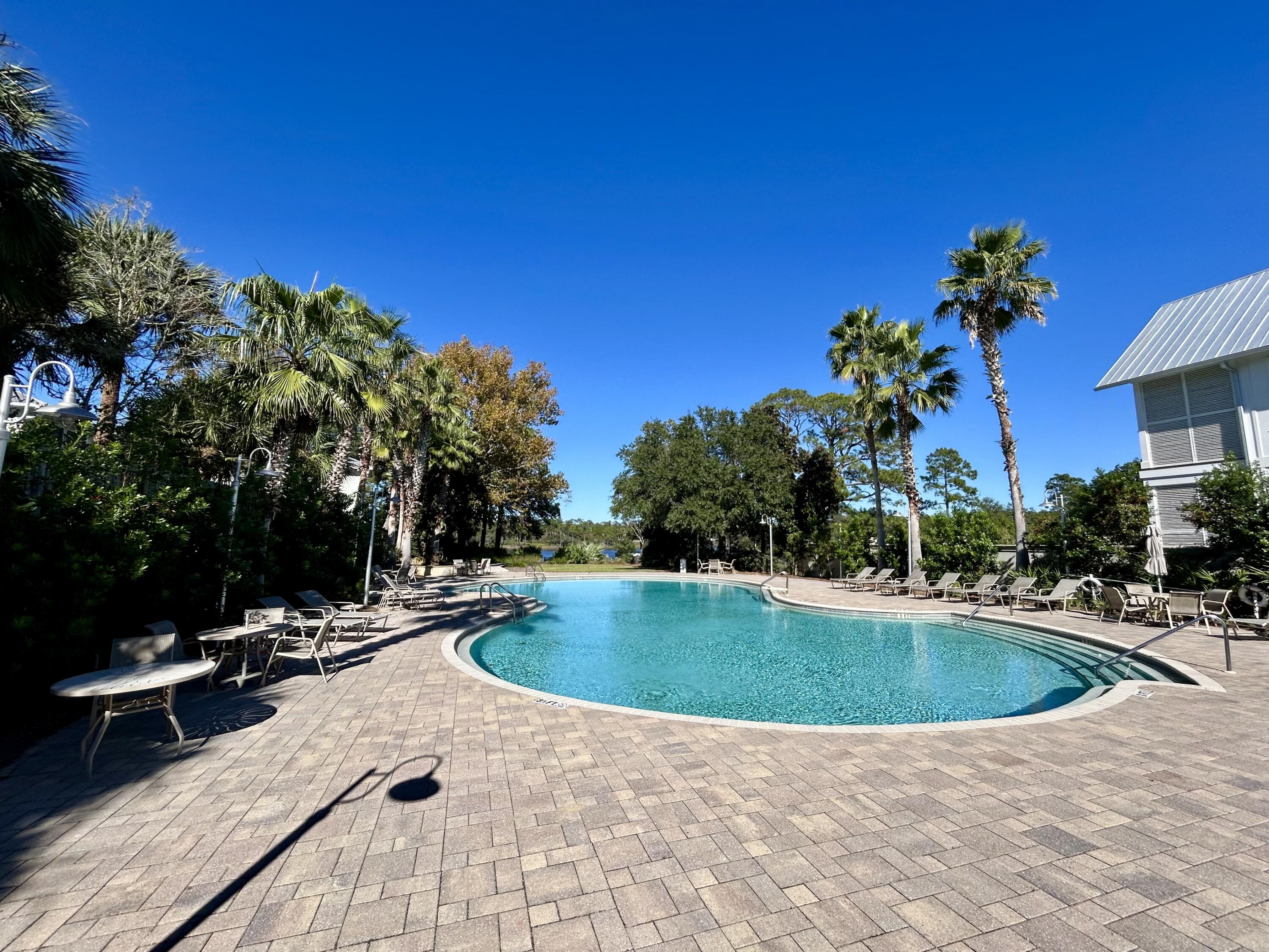 174 Grande Pointe Cir Inlet Beach Inlet Beach, FL 32461 - Photo 49 of 55 a view of pool with lawn chairs under an umbrella
