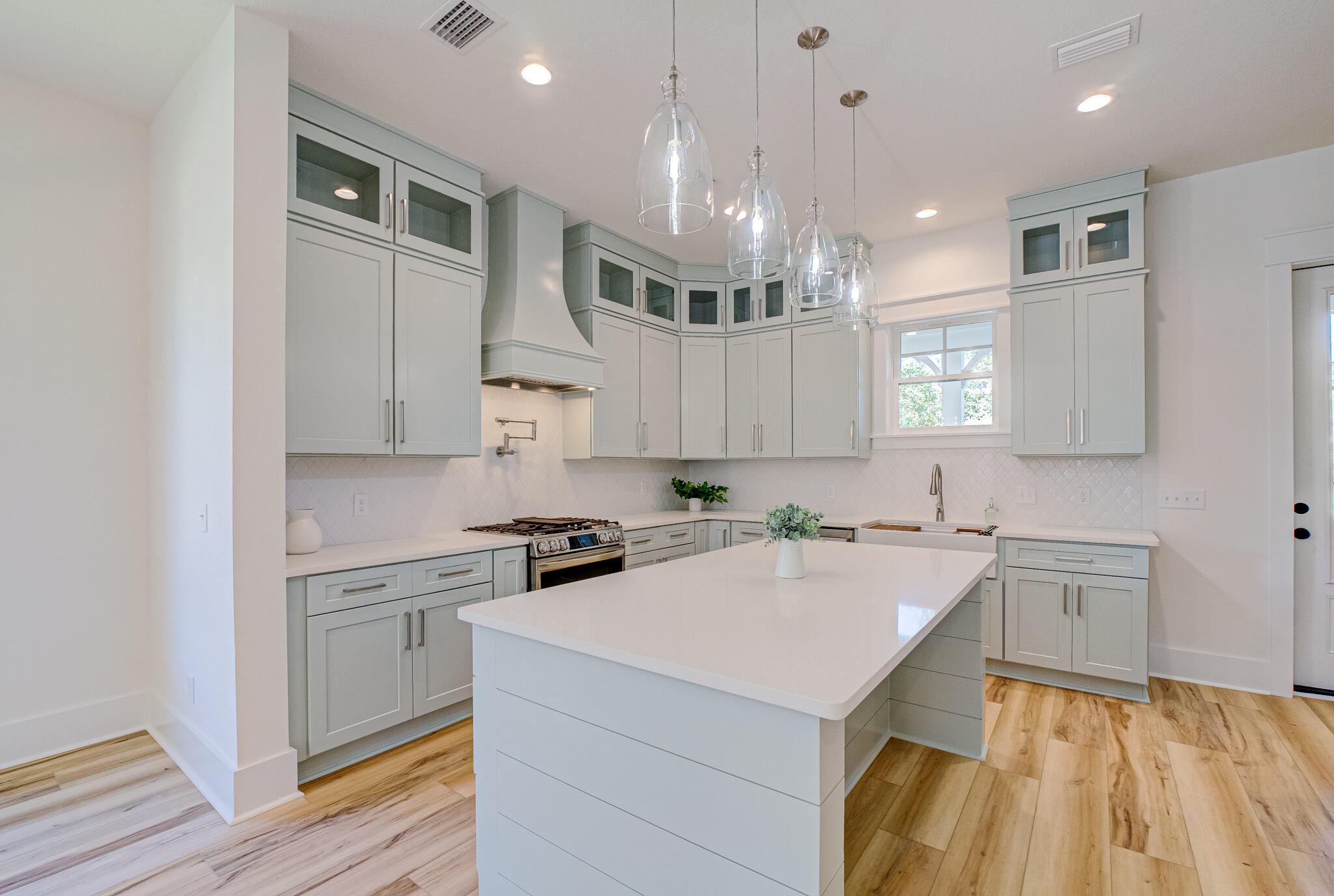 174 Grande Pointe Cir Inlet Beach Inlet Beach, FL 32461 - Photo 9 of 55 a kitchen with a sink a stove a refrigerator and cabinets