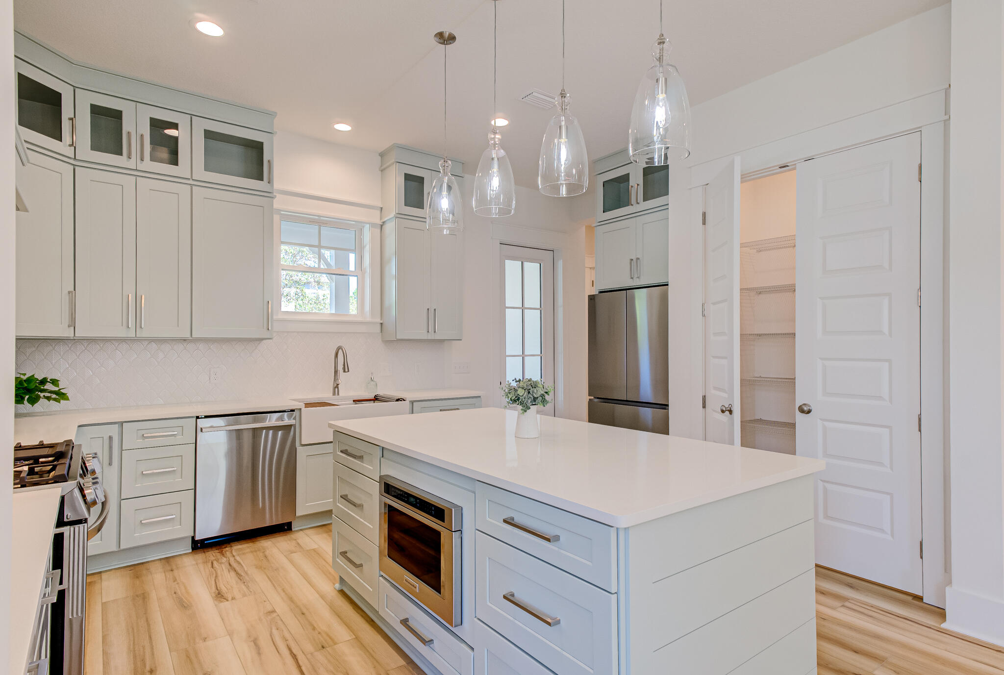 174 Grande Pointe Cir Inlet Beach Inlet Beach, FL 32461 - Photo 10 of 55 a kitchen with a stove a sink and a refrigerator