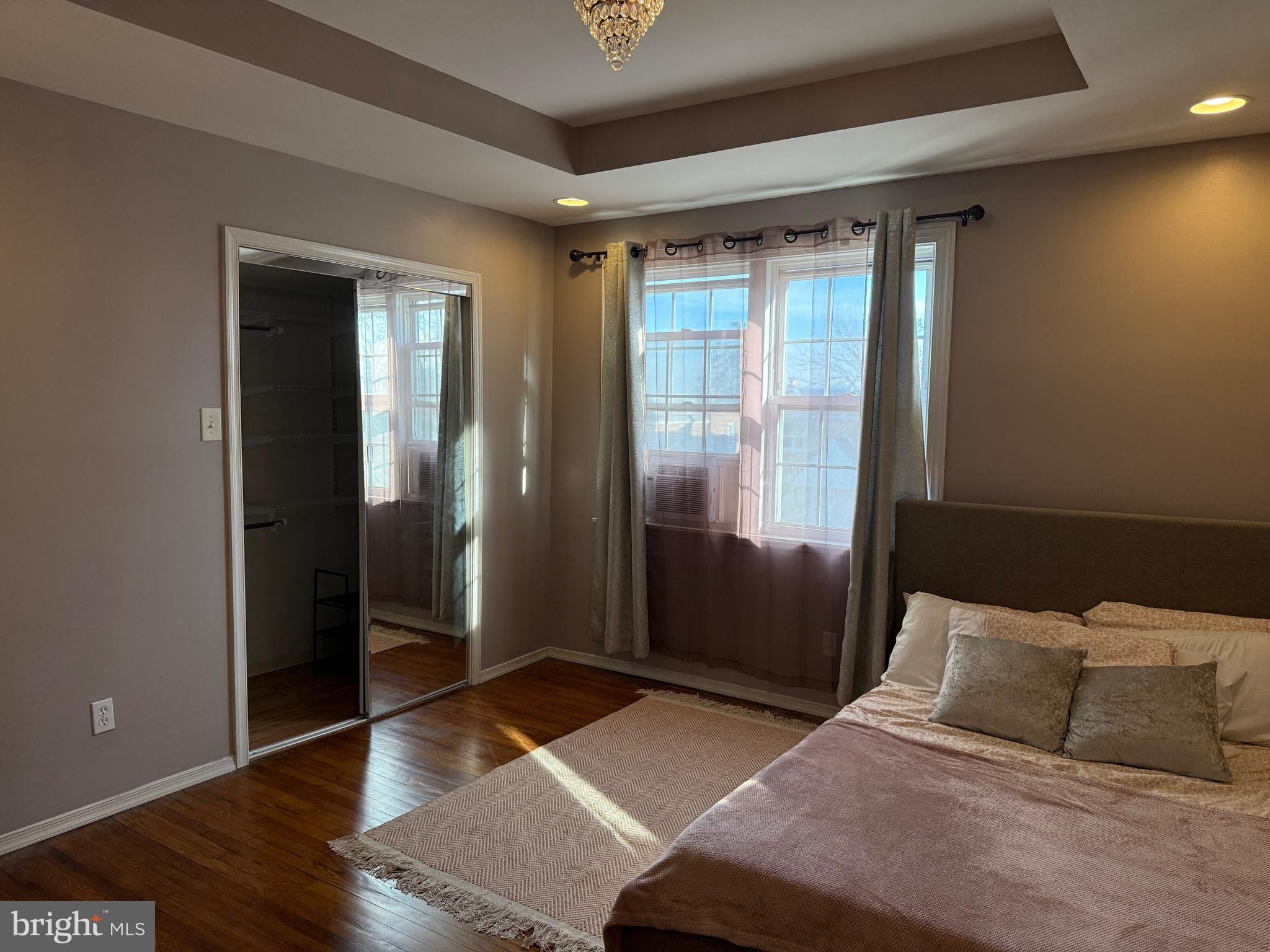 6234 Cottage Street Philadelphia, PA 19135 - Photo 6 of 16 a bedroom with a bed and wooden floor