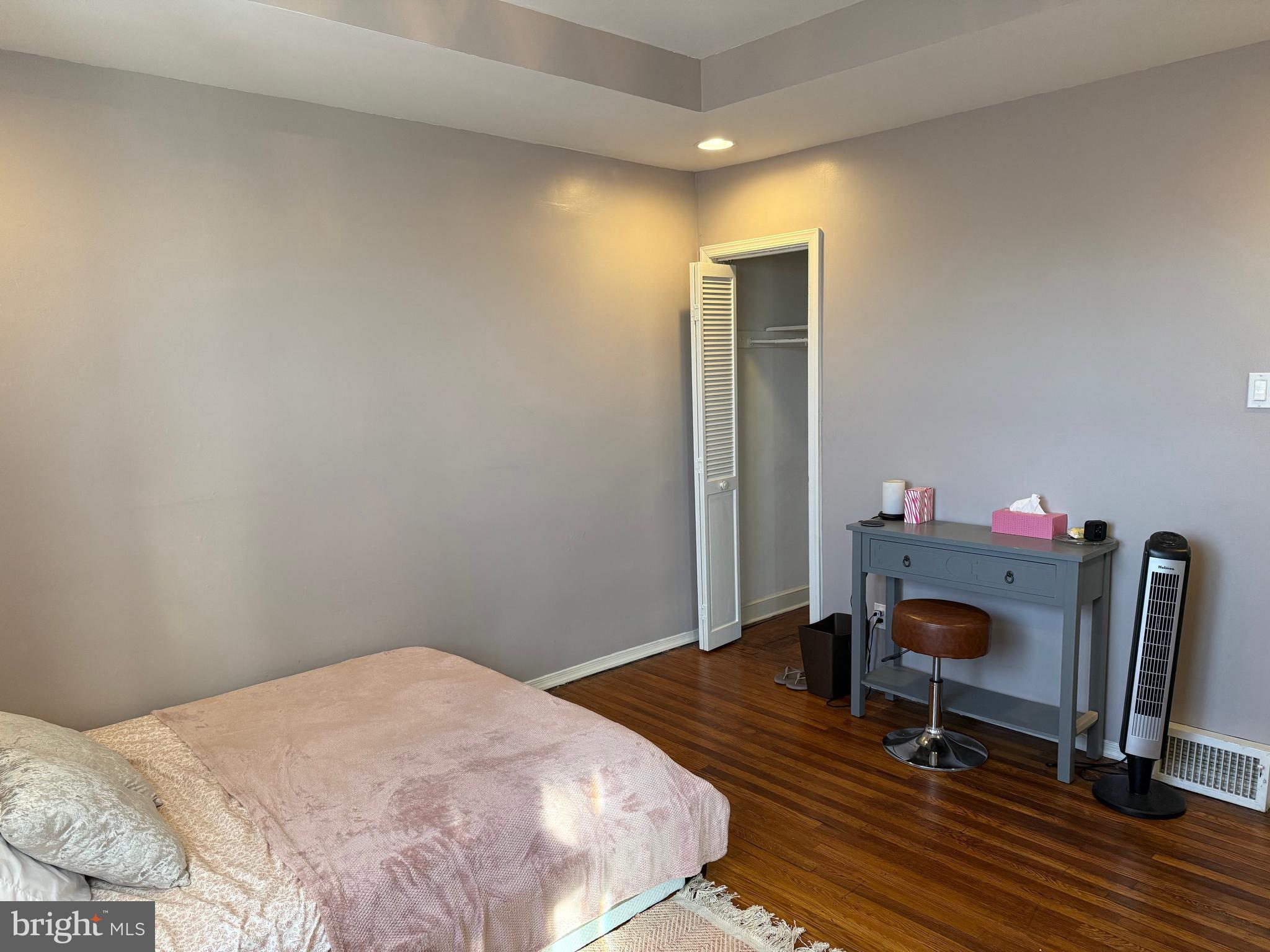 6234 Cottage Street Philadelphia, PA 19135 - Photo 7 of 16 a bedroom with a bed and a workspace