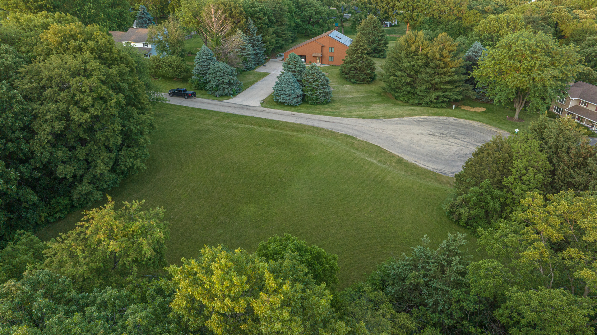 0 Lemke Drive Byron, IL 61010 - Photo 5 of 16 a view of a green yard with large trees