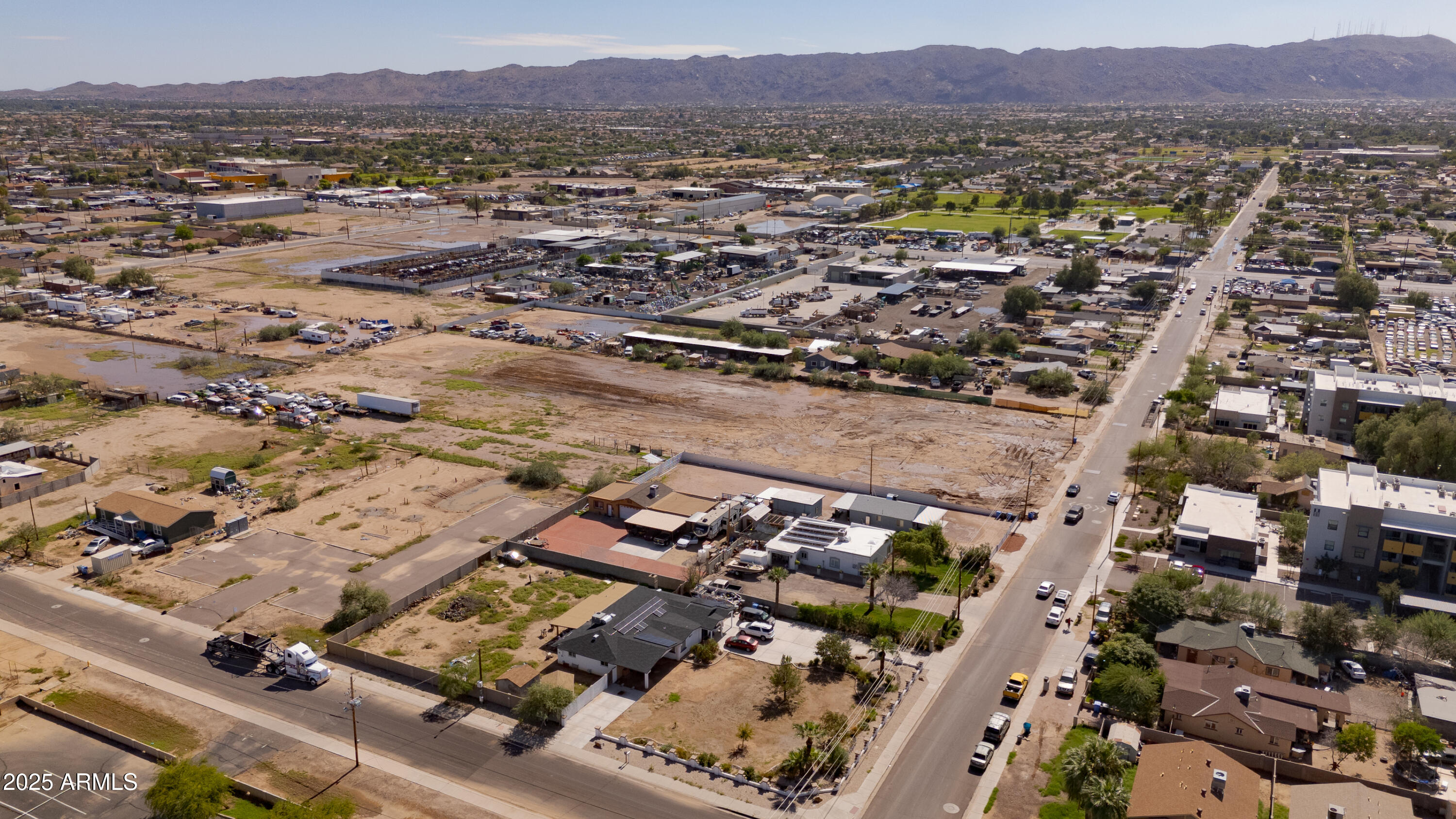 4035 South 9th Street, Unit 20/22 Phoenix, AZ 85040 - Photo 2 of 45 an aerial view of residential house and sandy dunes