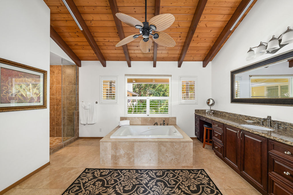 1444 East Kuiaha Road Haiku, HI 96708 - Photo 6 of 30 a spacious bathroom with a granite countertop tub sink and mirror