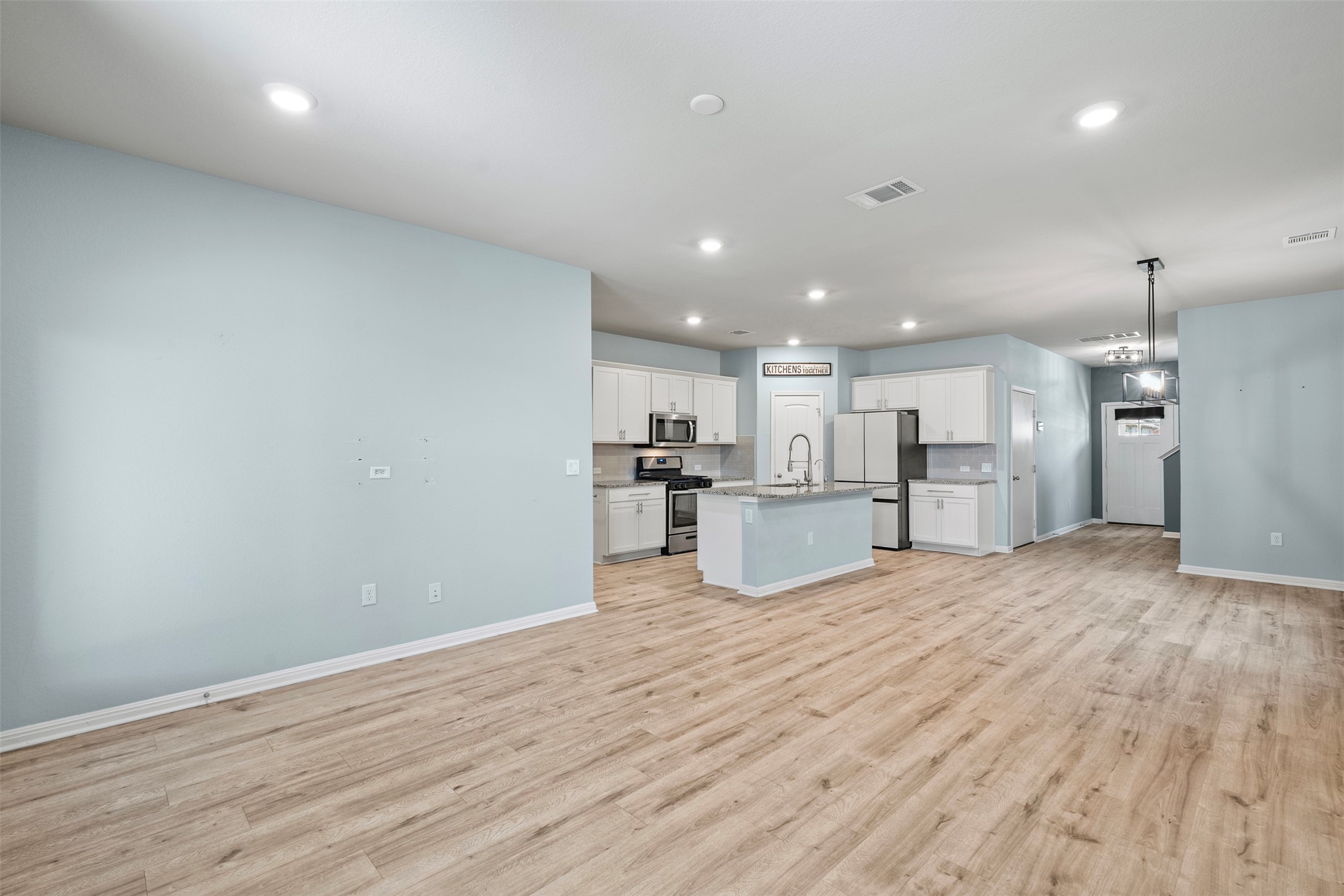 120 Ellinger Road Georgetown, TX 78626 - Photo 27 of 28 Open-concept living space with wood-finish flooring throughout