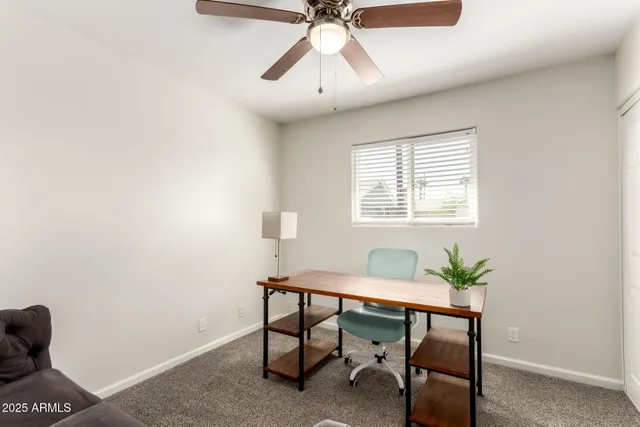 a workspace with furniture and window