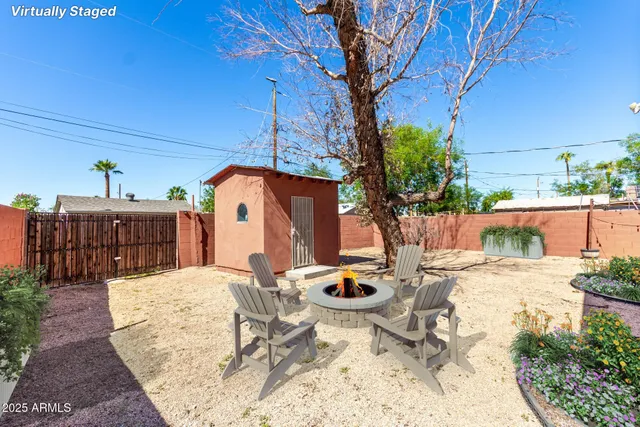 a view of a backyard of the house