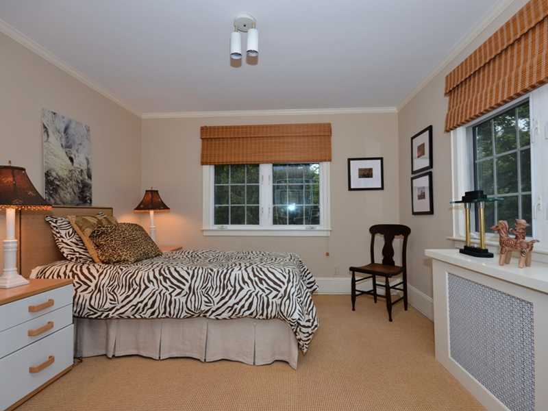 331 Hollow Tree Ridge Road Darien, CT 06820 - Photo 11 of 19 a bedroom with a bed furniture and a window