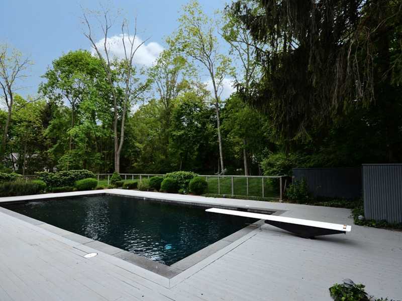331 Hollow Tree Ridge Road Darien, CT 06820 - Photo 16 of 19 a view of swimming pool with a bench