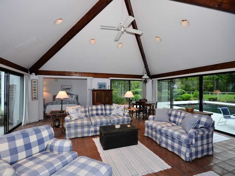 331 Hollow Tree Ridge Road Darien, CT 06820 - Photo 17 of 19 a living room with furniture and a large window