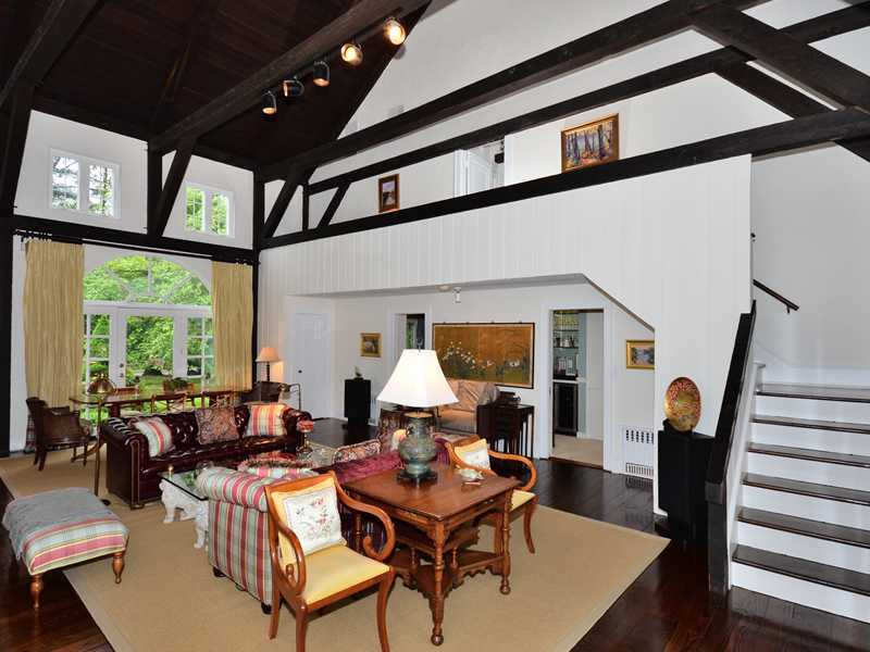 331 Hollow Tree Ridge Road Darien, CT 06820 - Photo 3 of 19 a living room with furniture and a large window