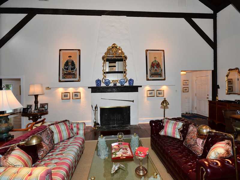 331 Hollow Tree Ridge Road Darien, CT 06820 - Photo 4 of 19 a living room with furniture and a fireplace