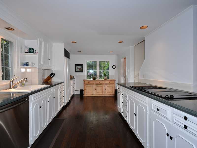 331 Hollow Tree Ridge Road Darien, CT 06820 - Photo 6 of 19 a kitchen with granite countertop a sink and cabinets