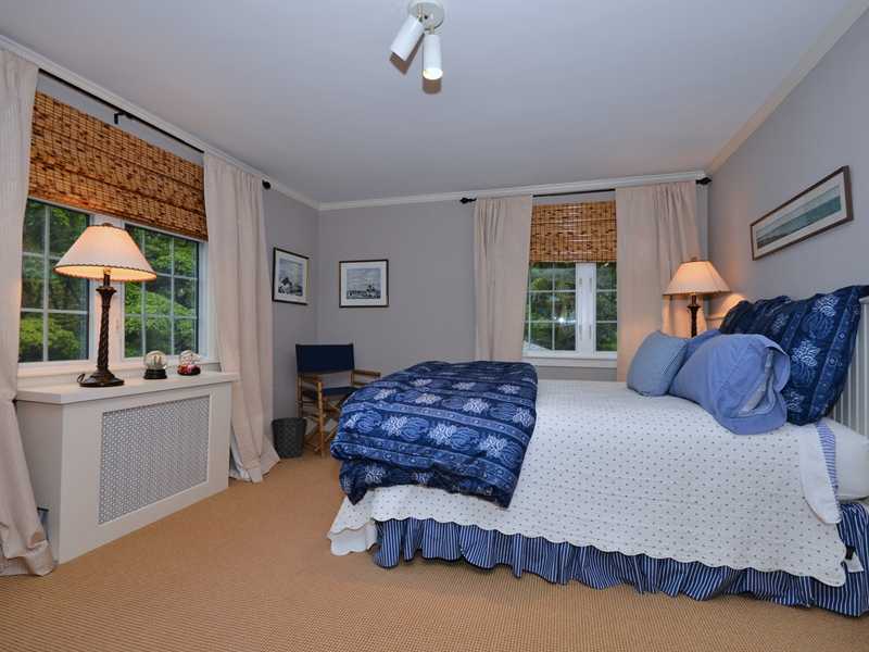 331 Hollow Tree Ridge Road Darien, CT 06820 - Photo 10 of 19 a bedroom with a large bed and a window