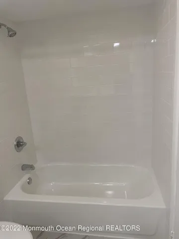 a bathroom with bathtub
