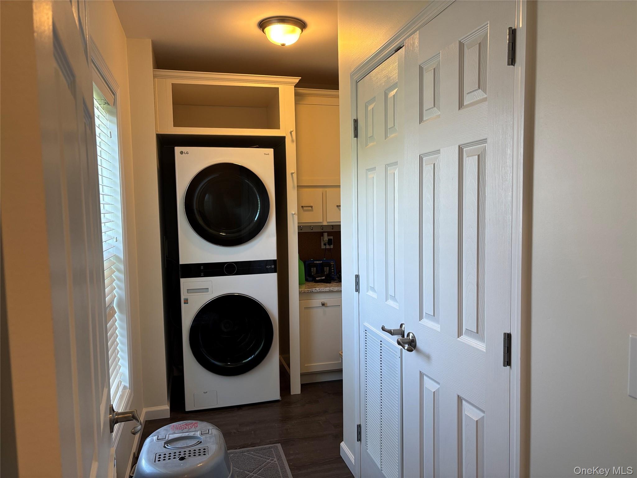 1661 Old Country Road, Unit 563 Riverhead, NY 11901 - Photo 24 of 43 a utility room with dryer and washer