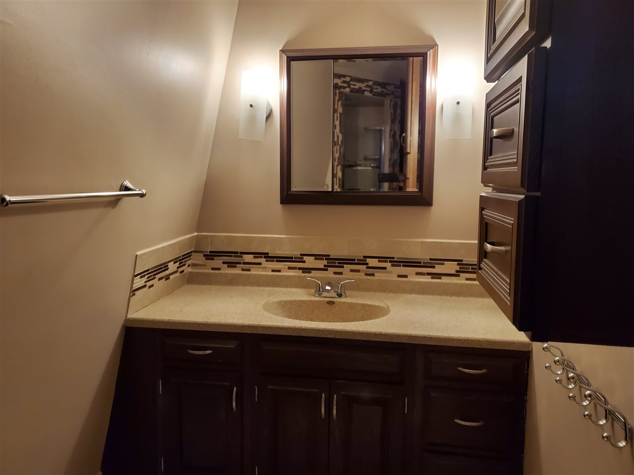 4802 Spring Creek Road Rockford, IL 61114 - Photo 14 of 25 a bathroom with a sink and a mirror