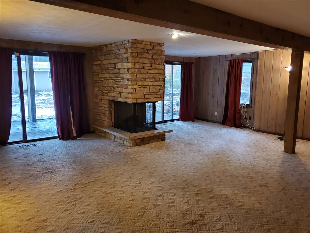 4802 Spring Creek Road Rockford, IL 61114 - Photo 18 of 25 a view of an empty room with a fireplace
