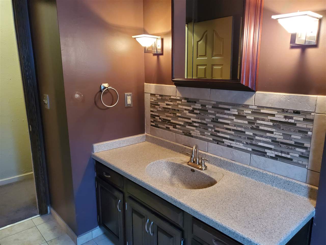 4802 Spring Creek Road Rockford, IL 61114 - Photo 21 of 25 a bathroom with a sink and a mirror