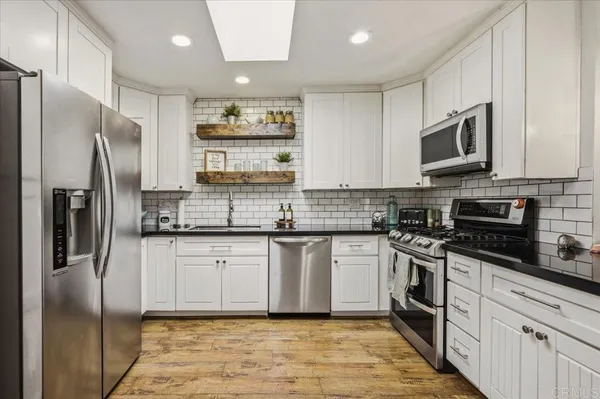a view of a dining room with furniture and window