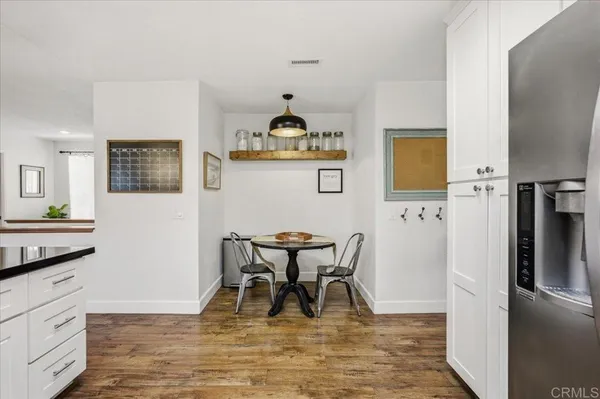 a living room with furniture a large window and a flat screen tv
