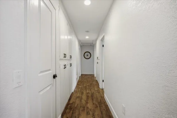 a bedroom with a bed and a chair