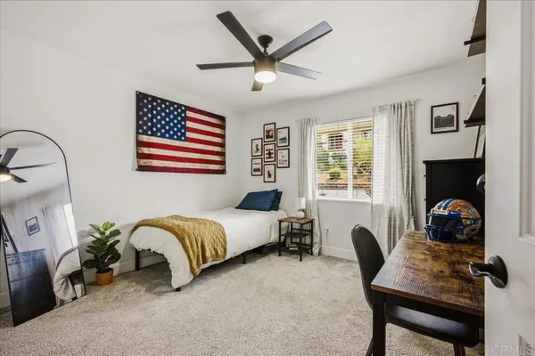 a bathroom with a glass shower door and a sink