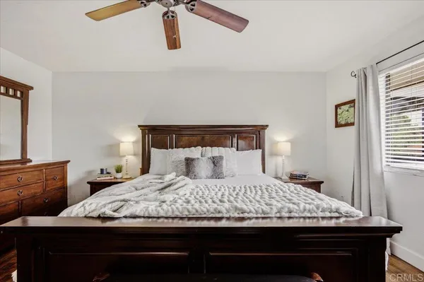 a view of a balcony with chairs and wooden floor