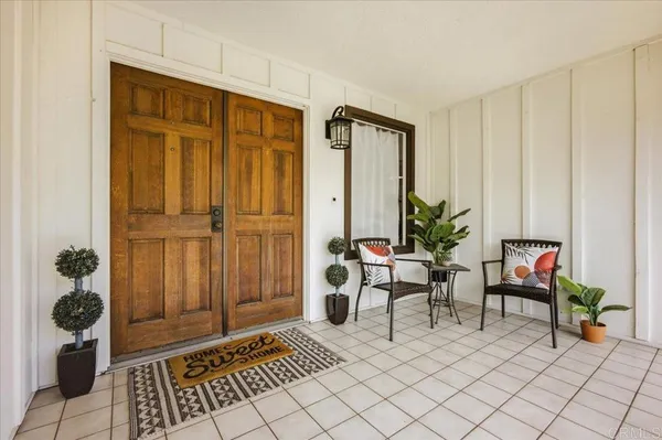 a living room with furniture a fireplace and a table