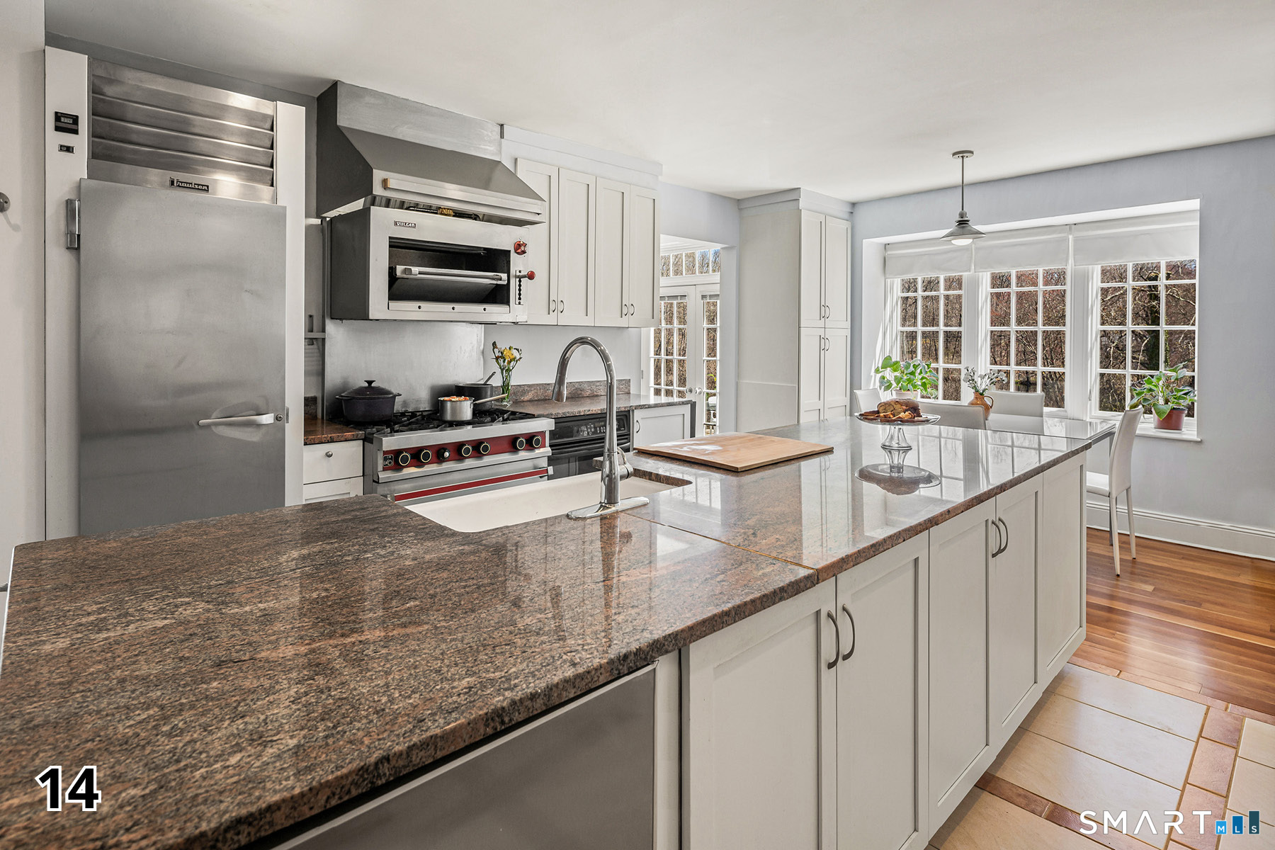 32 Steep Hill Road Weston, CT 06883 - Photo 11 of 41 a kitchen with granite countertop a sink and a refrigerator