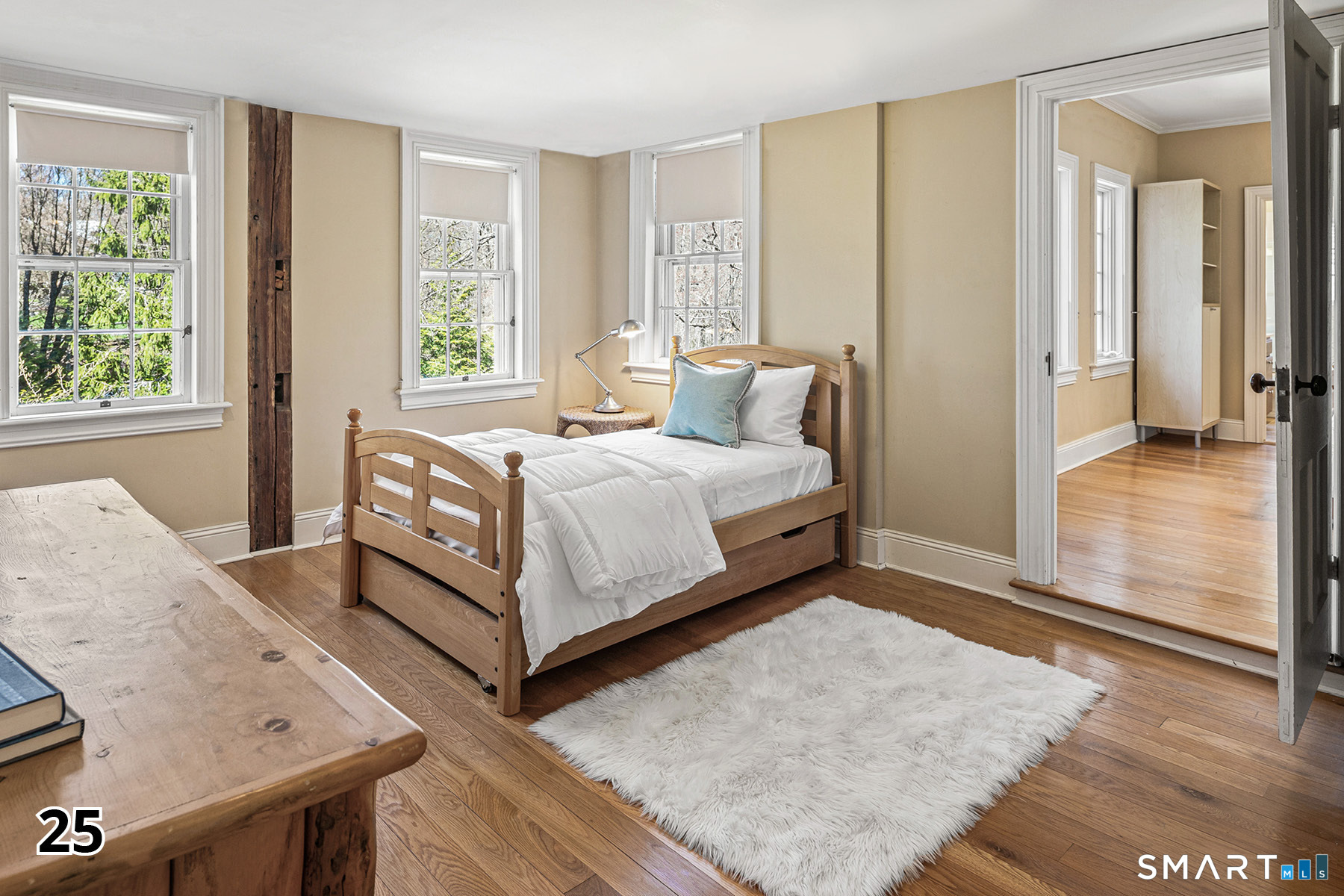 32 Steep Hill Road Weston, CT 06883 - Photo 20 of 41 a bed sitting in a bedroom next to a window