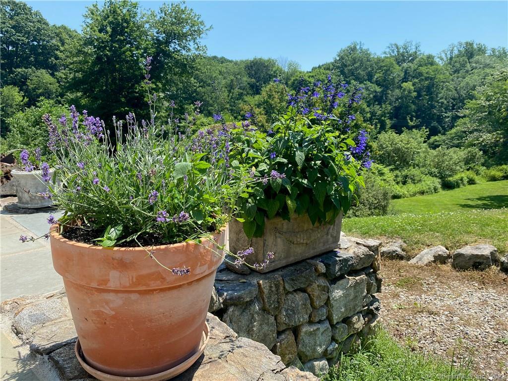 32 Steep Hill Road Weston, CT 06883 - Photo 37 of 40 A 500sf south-facing flagstone terrace flowers abundantly.