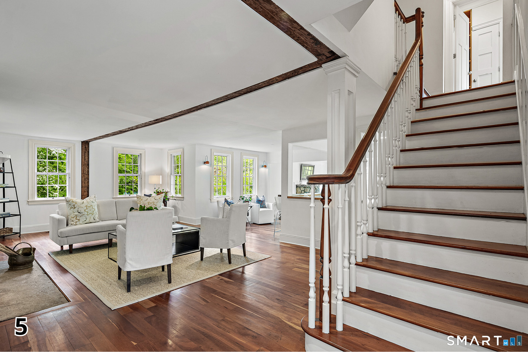 32 Steep Hill Road Weston, CT 06883 - Photo 4 of 41 a living room with wooden floor furniture and a table