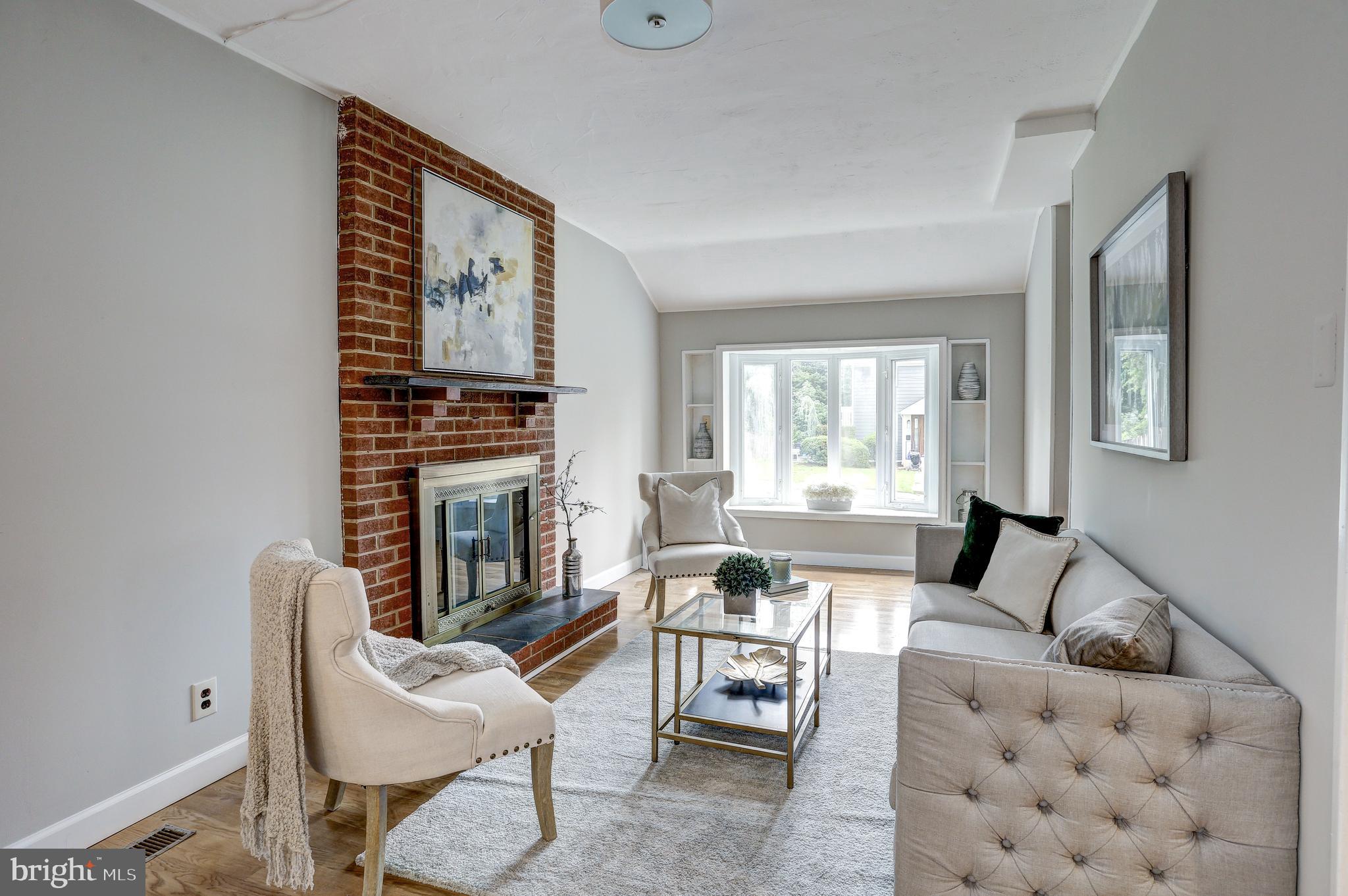 5322 Wakefield Road Bethesda, MD 20816 - Photo 13 of 39 Bay window and fireplace in the living room.